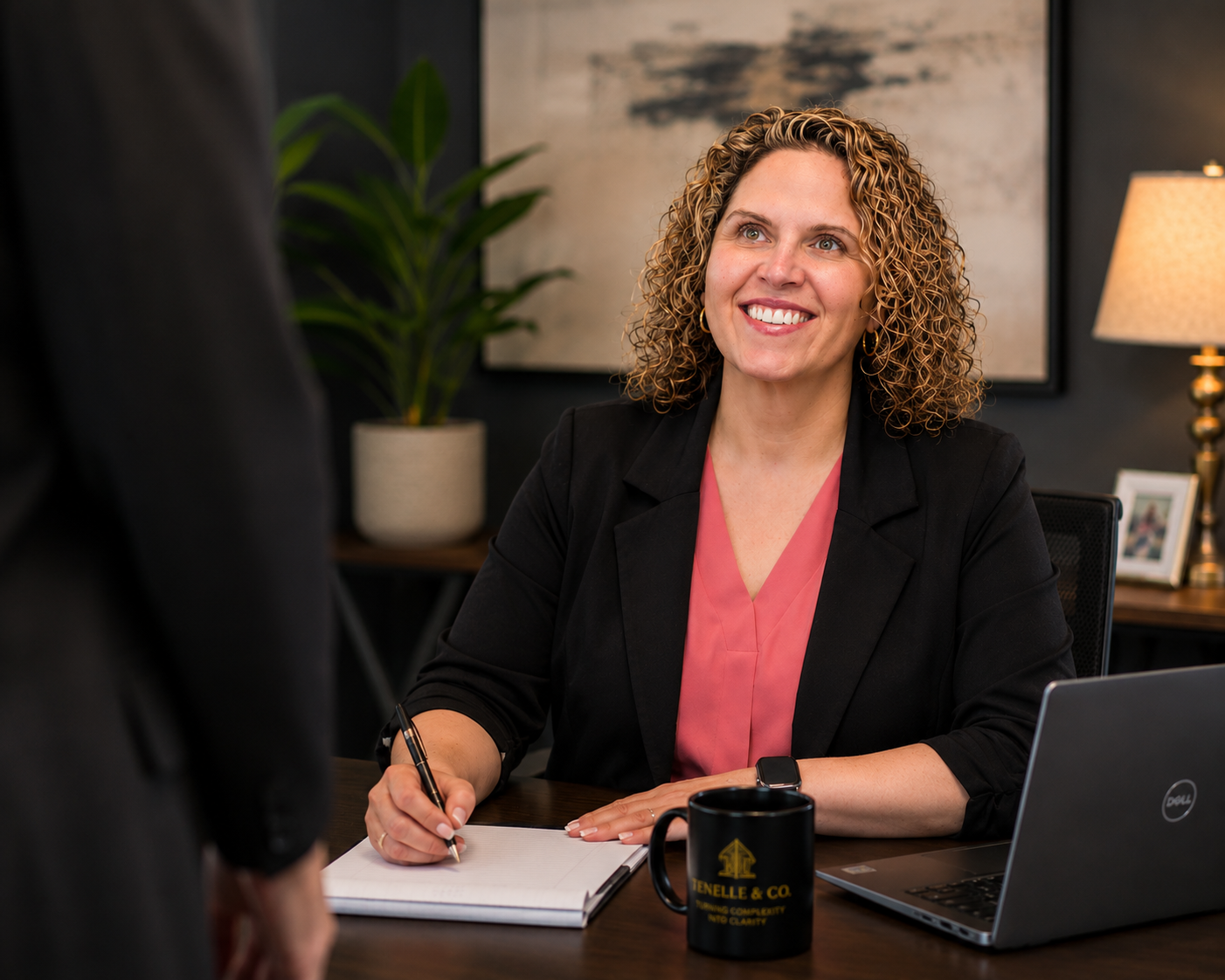 Angela Githens meeting with a client at her desk
